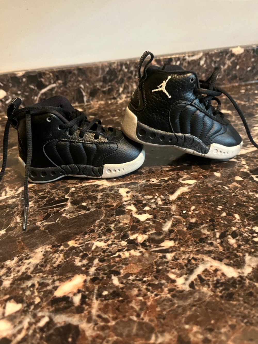 Jordan Kids Black and White High-Top Sneakers